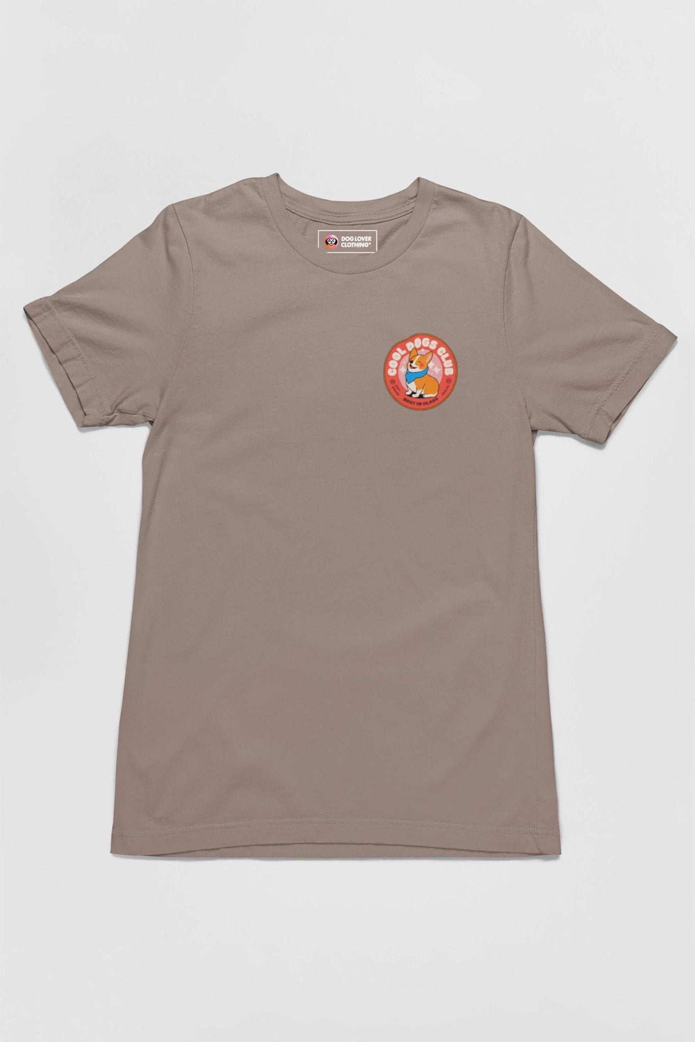 Dogloverclothing.coms Cool Dogs Club Unisex Hype T-Shirt is khaki with a circular patch on the left chest, featuring a colorful cartoon character and the words Keep Going Keep Growing. Ideal for dog lovers and Cool Dogs Club members.