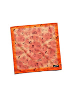 Orange tie dye dog bandana from WOOF, front view of the print