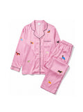 Pink silky dog pajama set from WOOF, front view of the top and trousers