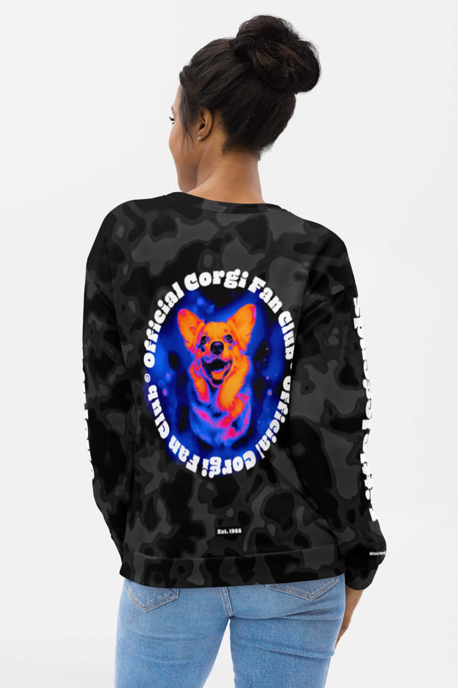 Woman seen from behind in the black Corgi Fan Club Elite Camo Sweatshirt from WOOF with the circular corgi badge