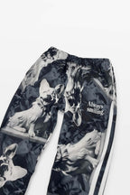 Dogloverclothing.coms Corgi Supreme Tribute Joggers are eco-friendly black and white sweatpants featuring smiling dogs and Always smiling. Made from recycled materials, they have a drawstring waistband and white side stripes.