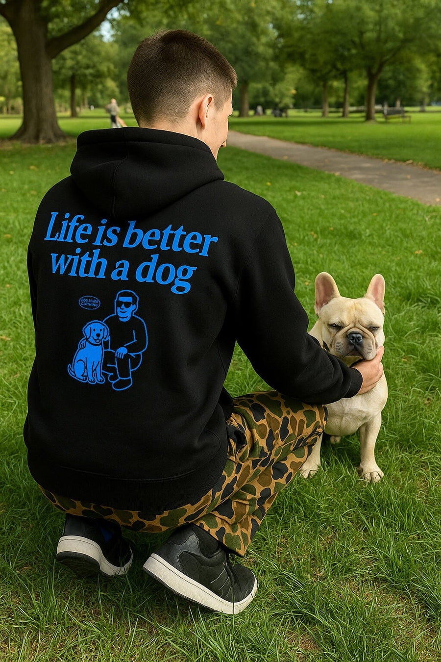 Model wearing the black Life is Better with a Dog Hoodie from WOOF