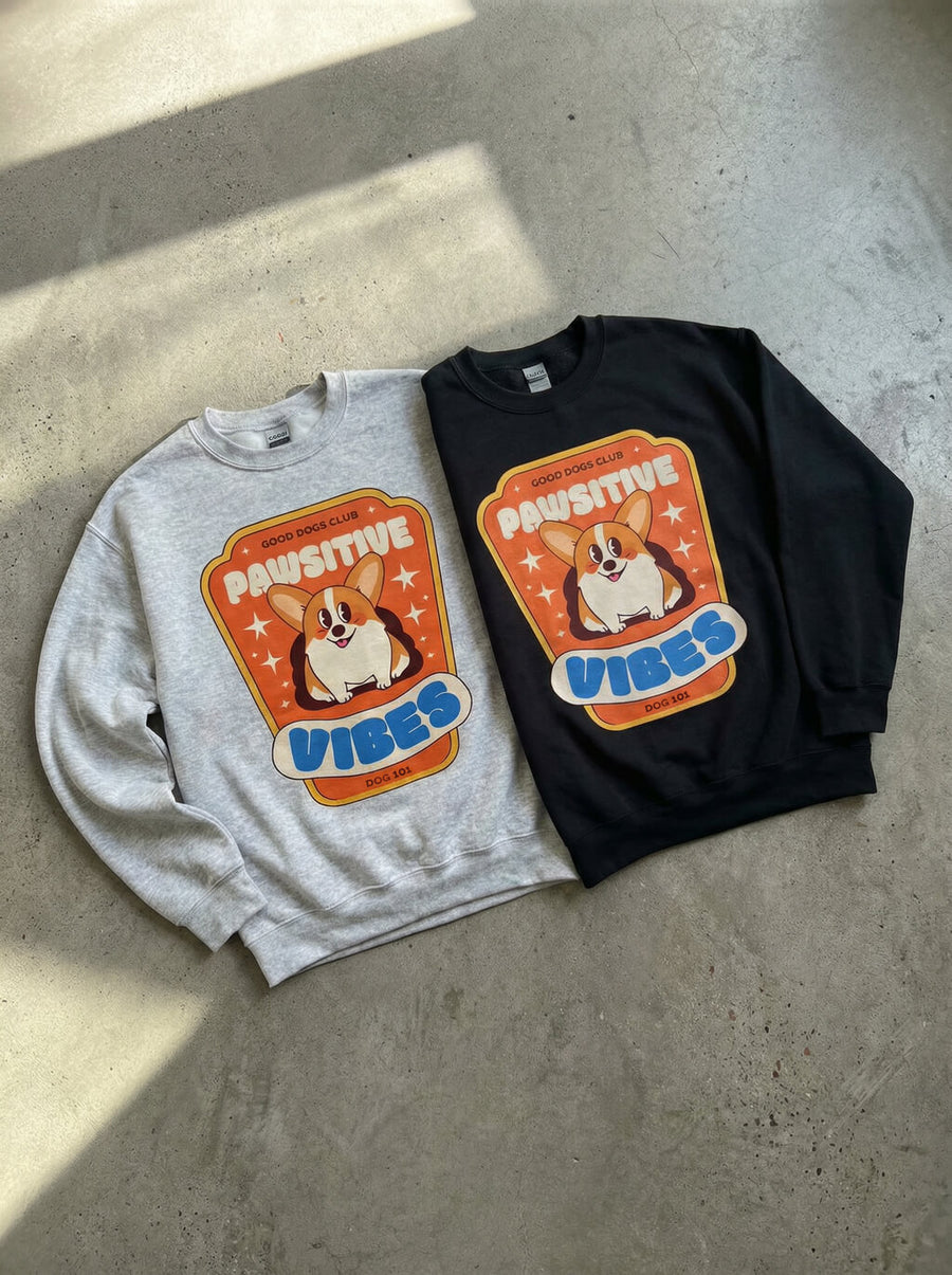 Pawsitive Vibes Corgi Sweatshirts from WOOF in grey and black shown side by side
