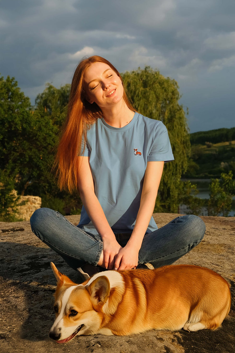 Model wearing the steel blue Corgi Bobtail Buddy T-Shirt from WOOF