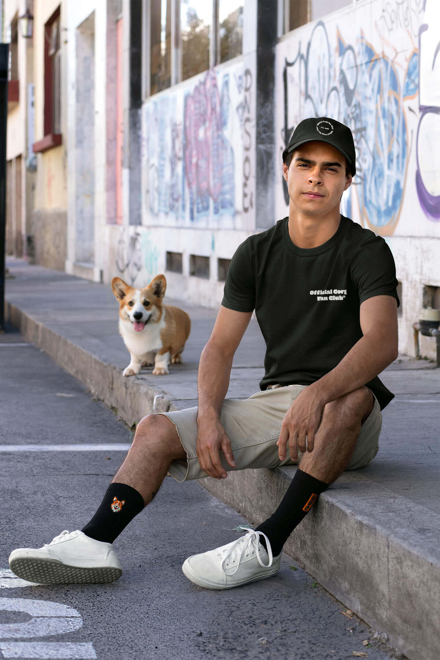 Black Corgi Fan Club T-Shirt from WOOF, front view with the club badge