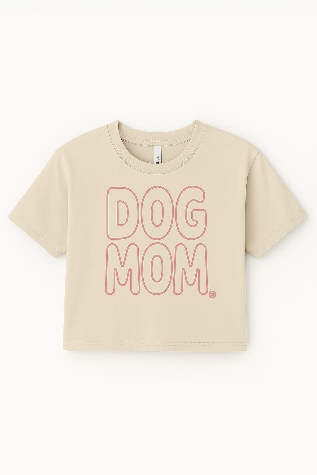 The Oversized Dog Mom Crop Top from Dogloverclothing.com features bold, outlined pink DOG MOM. lettering on beige—perfect for showing off your Dog Mom lifestyle.