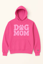 The Dog Mom Hoodie by Dogloverclothing.com is bright pink with “DOG MOM” in bold light pink letters on the front, featuring a unique paw print for the “O” and a convenient front pocket.