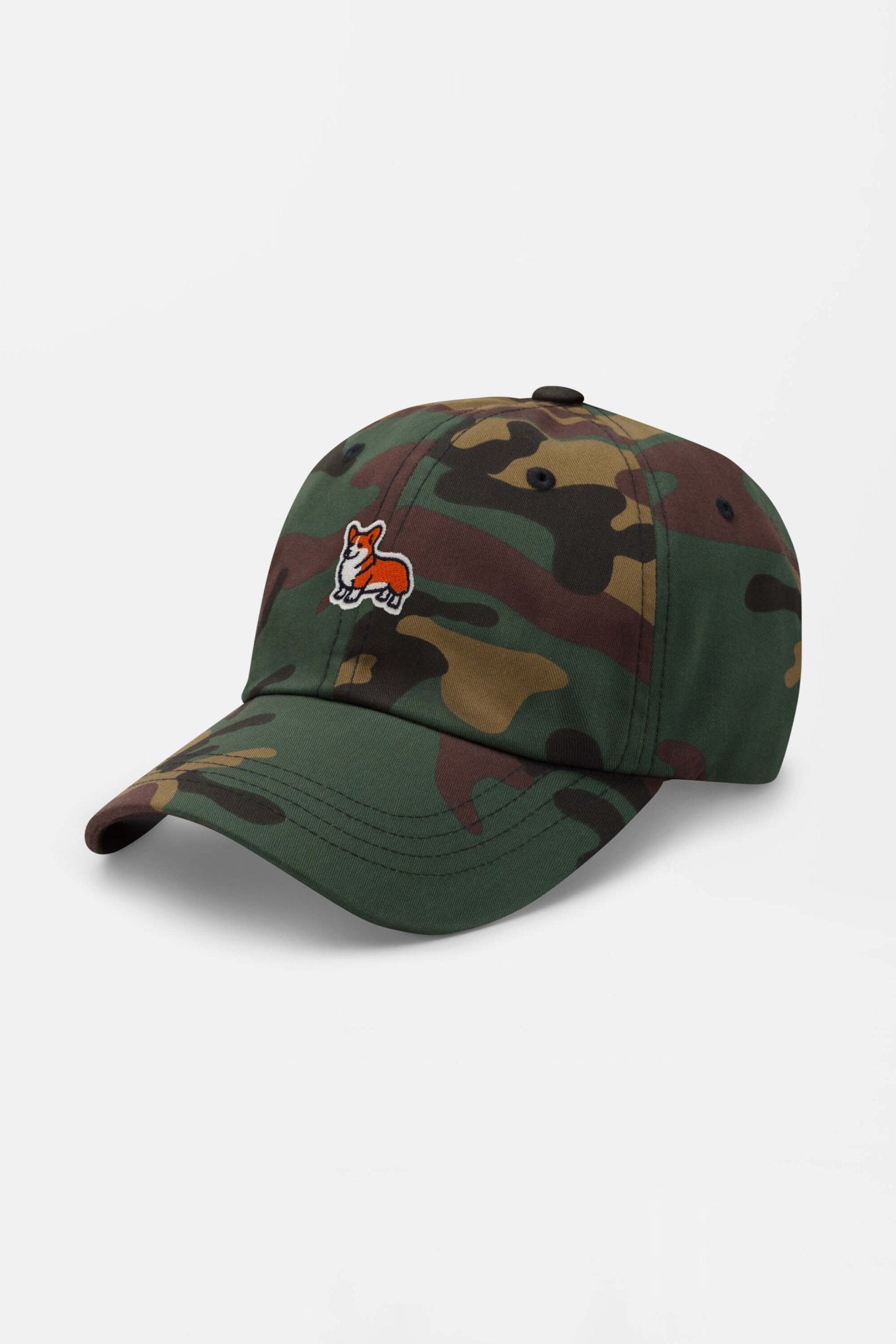 The Iconic Corgi Cap by Dogloverclothing.com features a green camo design with an embroidered red and white corgi patch on the front, perfect for showing off your corgi love. Displayed against a plain white background.