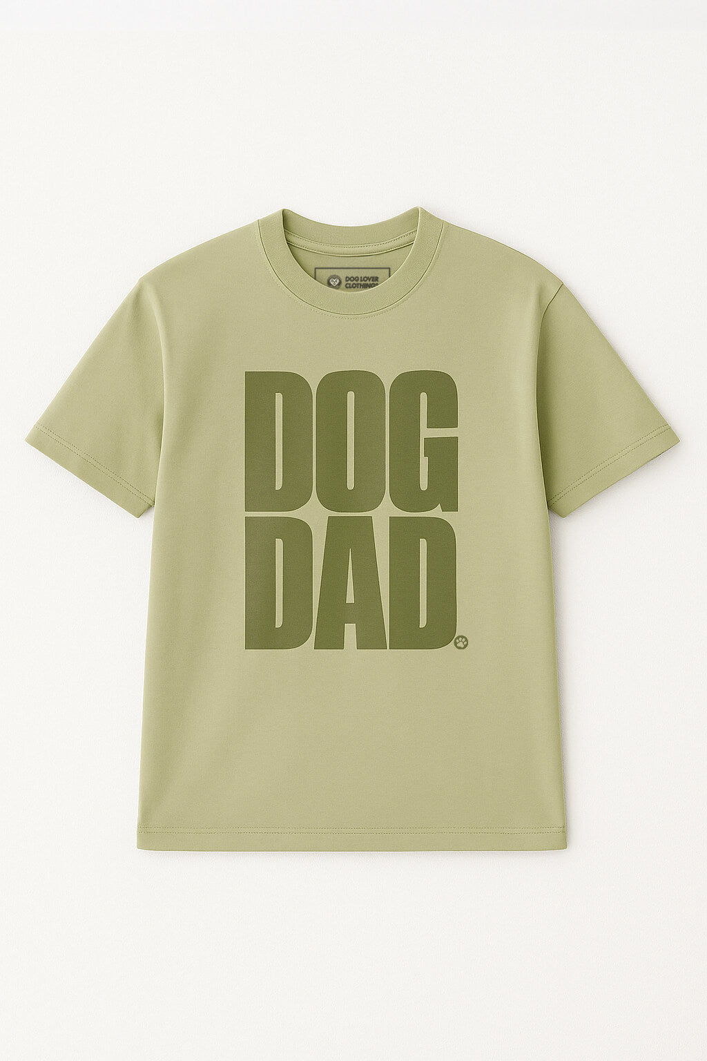 Oversized Dog Dad T-Shirt by Dogloverclothing.com in light green cotton, featuring bold dark green DOG DAD text on the front, shown flat against a light background.
