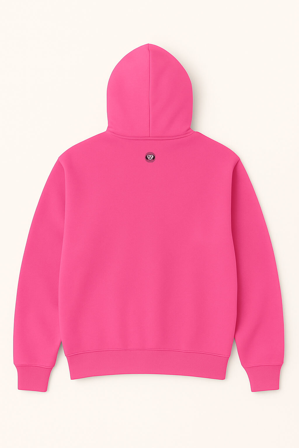 A bright pink Dog Mom Hoodie by Dogloverclothing.com lays flat, back up, showcasing a small round black and white paw print logo below the hood.
