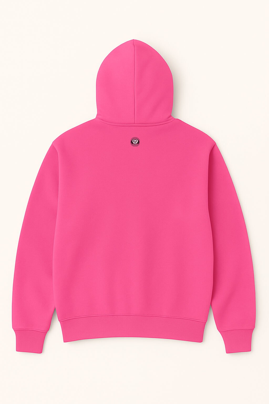 A bright pink Dog Mom Hoodie by Dogloverclothing.com lays flat, back up, showcasing a small round black and white paw print logo below the hood.