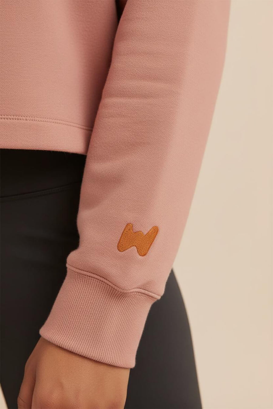 Close up of the hem and fabric on the red Good Girl Crop Sweatshirt from WOOF