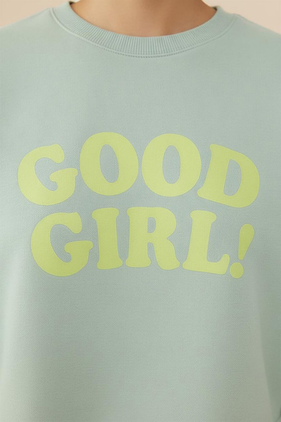 Print detail on the mint green Good Girl Crop Sweatshirt from WOOF