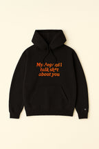 The Bold My Dog And I Talk Embroidered Hoodie by Dogloverclothing.com is a black hoodie made from premium fabric, featuring a front pocket and orange embroidery reading My dog and I talk sh*t about you, shown on a plain light background.