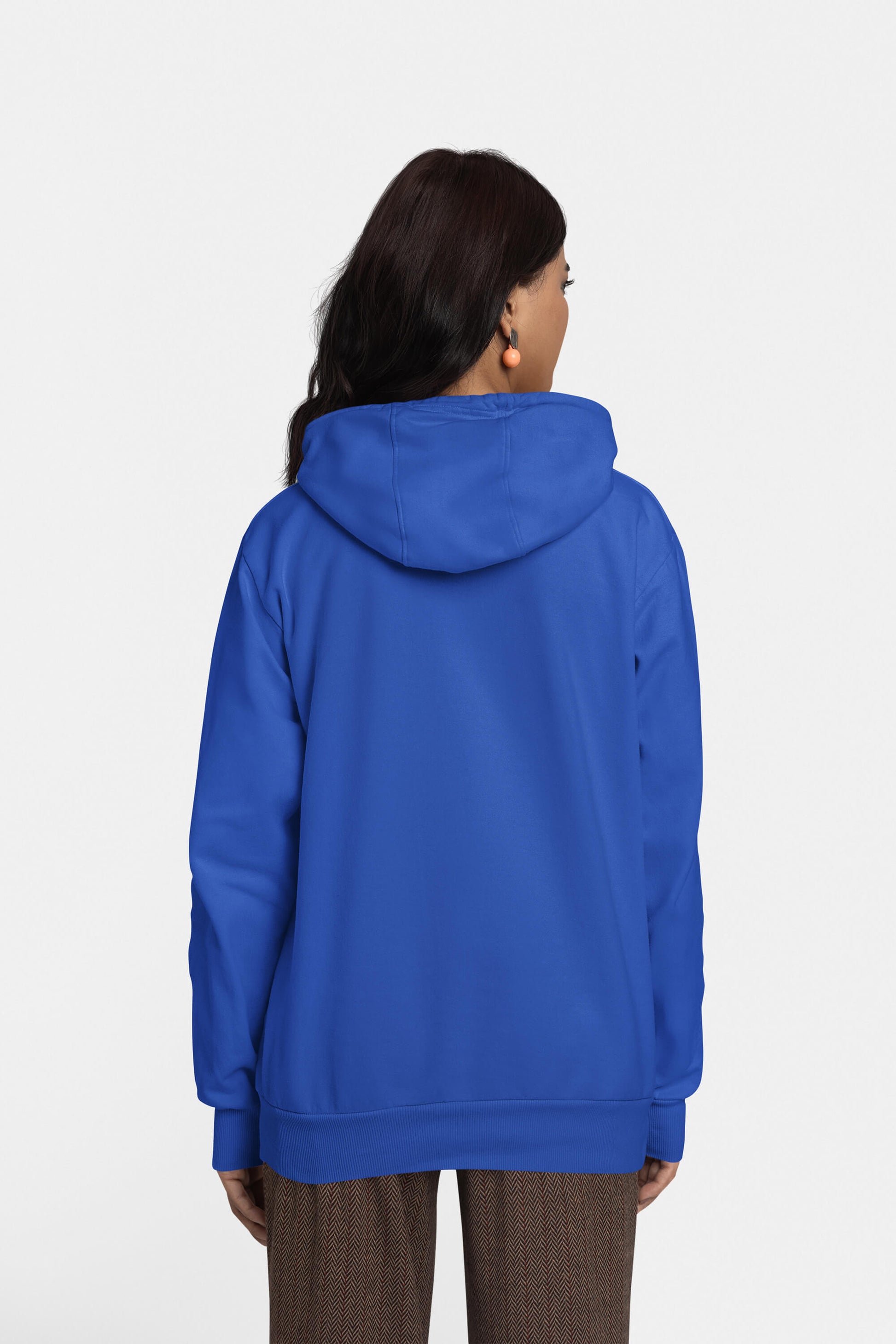 A person with long dark hair stands facing away, wearing the Unisex Dog Walker© Premium Hoodie in bright blue by Dogloverclothing.com. Paired with brown checkered pants, the stylish look is highlighted against a clean white backdrop, capturing an everyday adventure vibe.