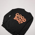 The Good Boy Sweater by Dogloverclothing.com is a black sweatshirt with GOOD BOY! in bold orange letters. Ideal for dog lovers, its showcased against a white background and pairs perfectly with dog bandanas.