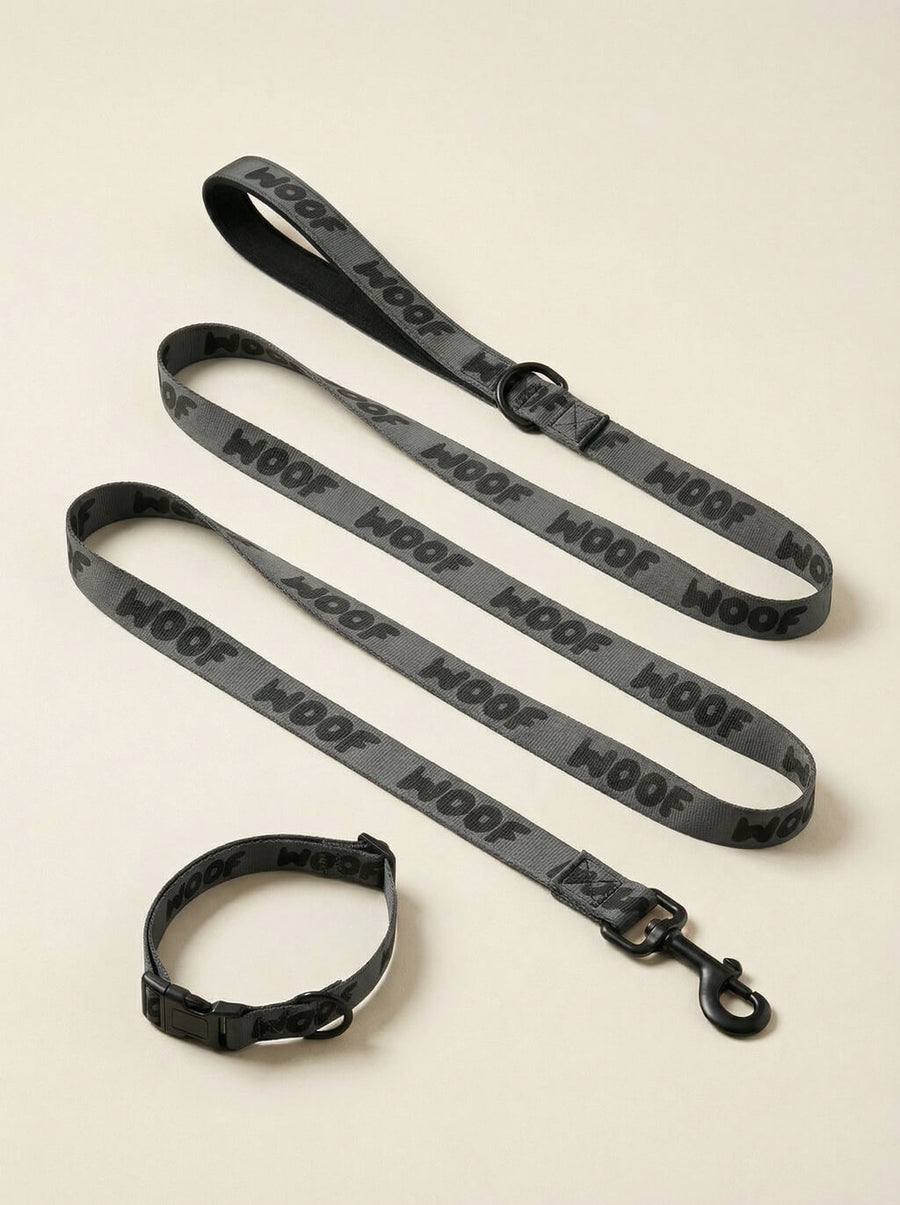 All black WOOF dog collar and leash set, front view