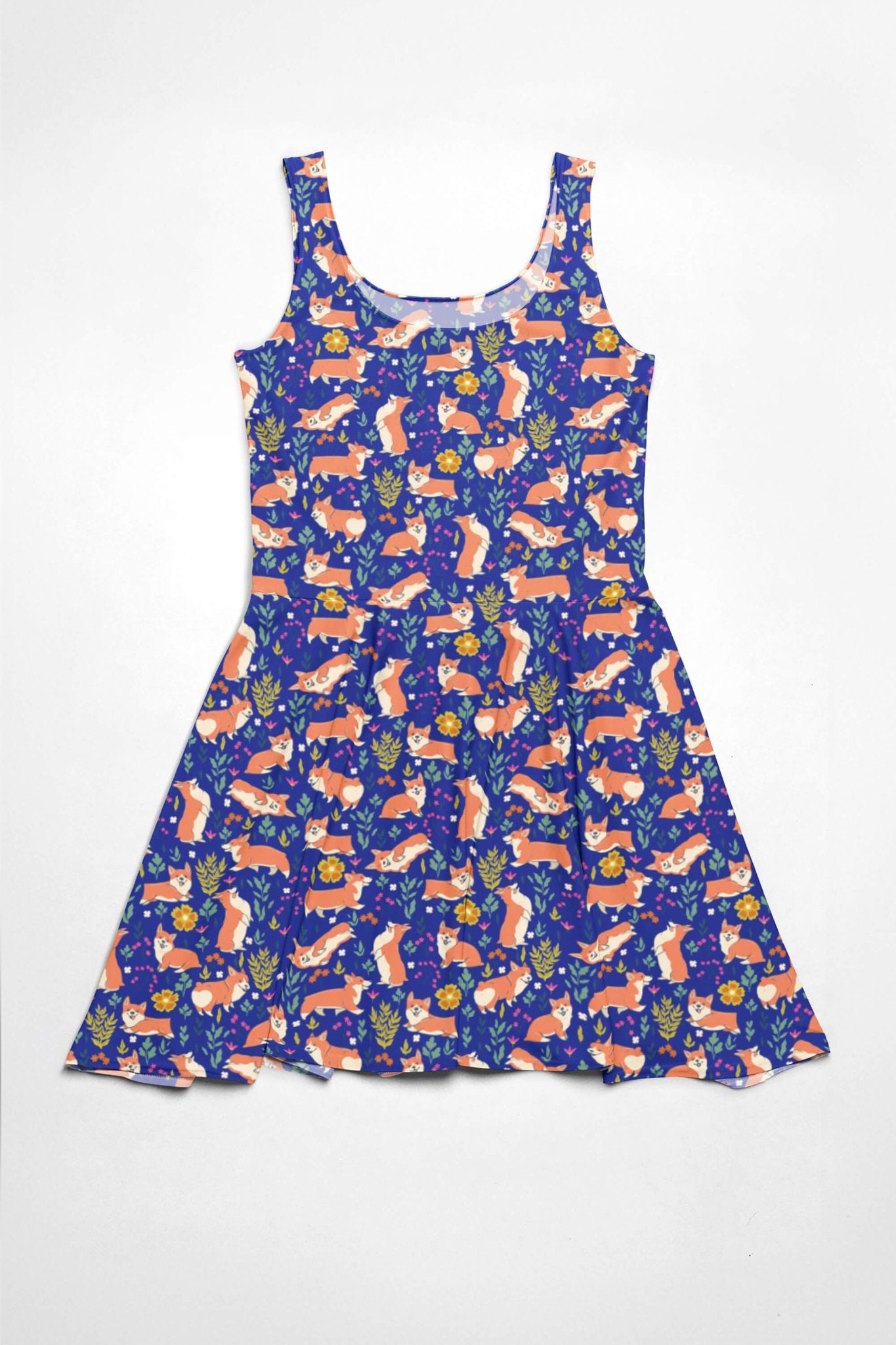 The Cute Corgi Garden Party Skater Dress by Dogloverclothing.com features a fitted bodice and flared skirt with a playful fox, flower, and foliage pattern on a dark blue background, creating a casual and whimsical look.