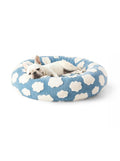 Cloud pattern donut dog bed from WOOF, front view of the plush pile