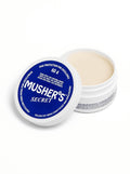 Mushers Secret dog paw balm from WOOF, front of the tin