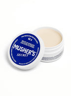 Mushers Secret dog paw balm from WOOF, front of the tin