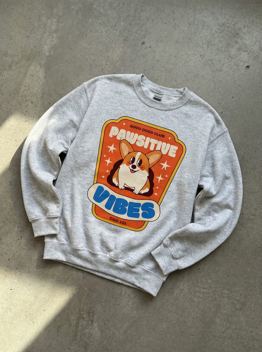 Pawsitive Vibes Corgi Sweatshirt from WOOF, front view with the corgi print