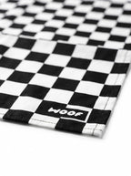 Close up of the checkered pattern on the dog bandana from WOOF