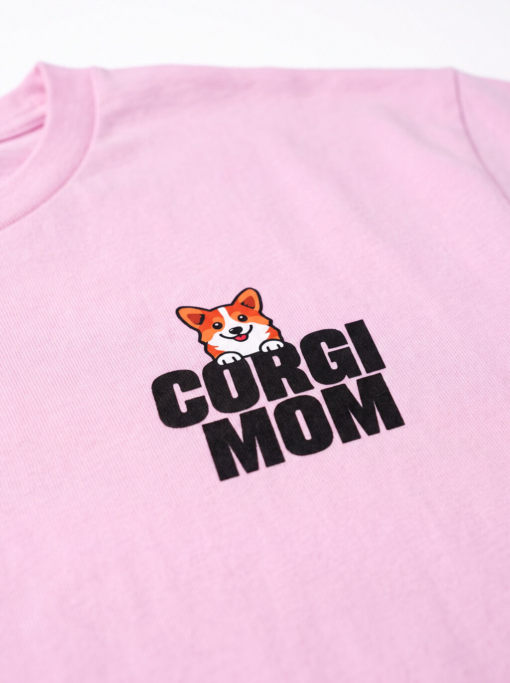 Close up of the corgi mom print on the lilac T-Shirt from WOOF
