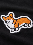 Close up of the corgi patch on the black embroidered T-Shirt from WOOF