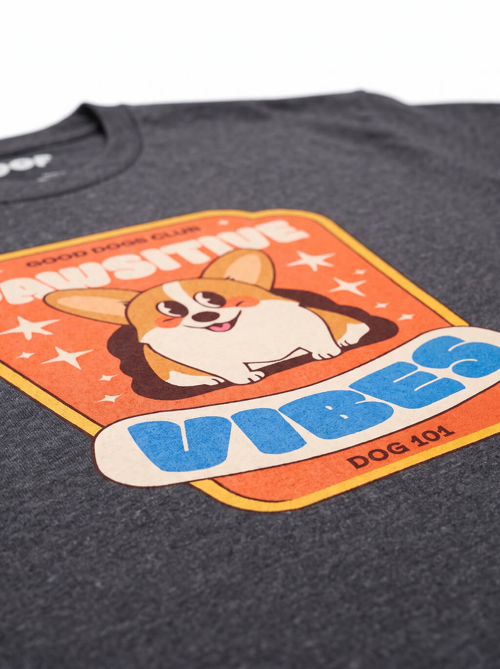 Close up of the print on the heather black Pawsitive Vibes Corgi T-Shirt from WOOF