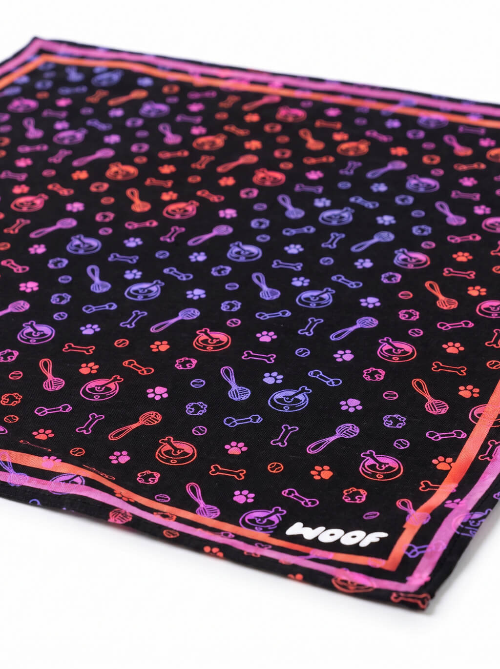 Close up of the neon print on the black Playful Neon Dog Bandana from WOOF