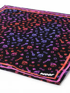Close up of the neon print on the black Playful Neon Dog Bandana from WOOF
