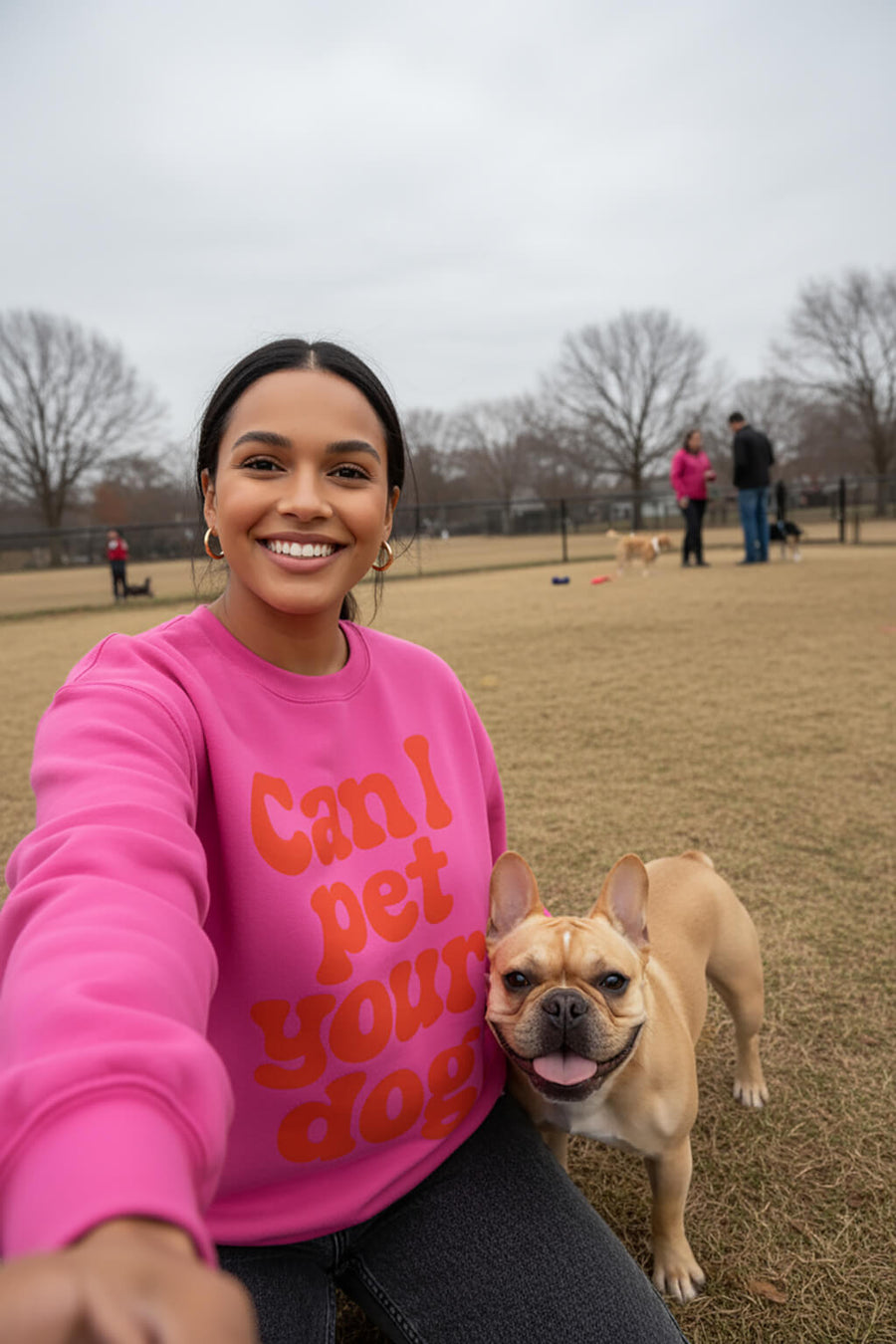 Model wearing the pink Can I Pet Your Dog Sweatshirt from WOOF