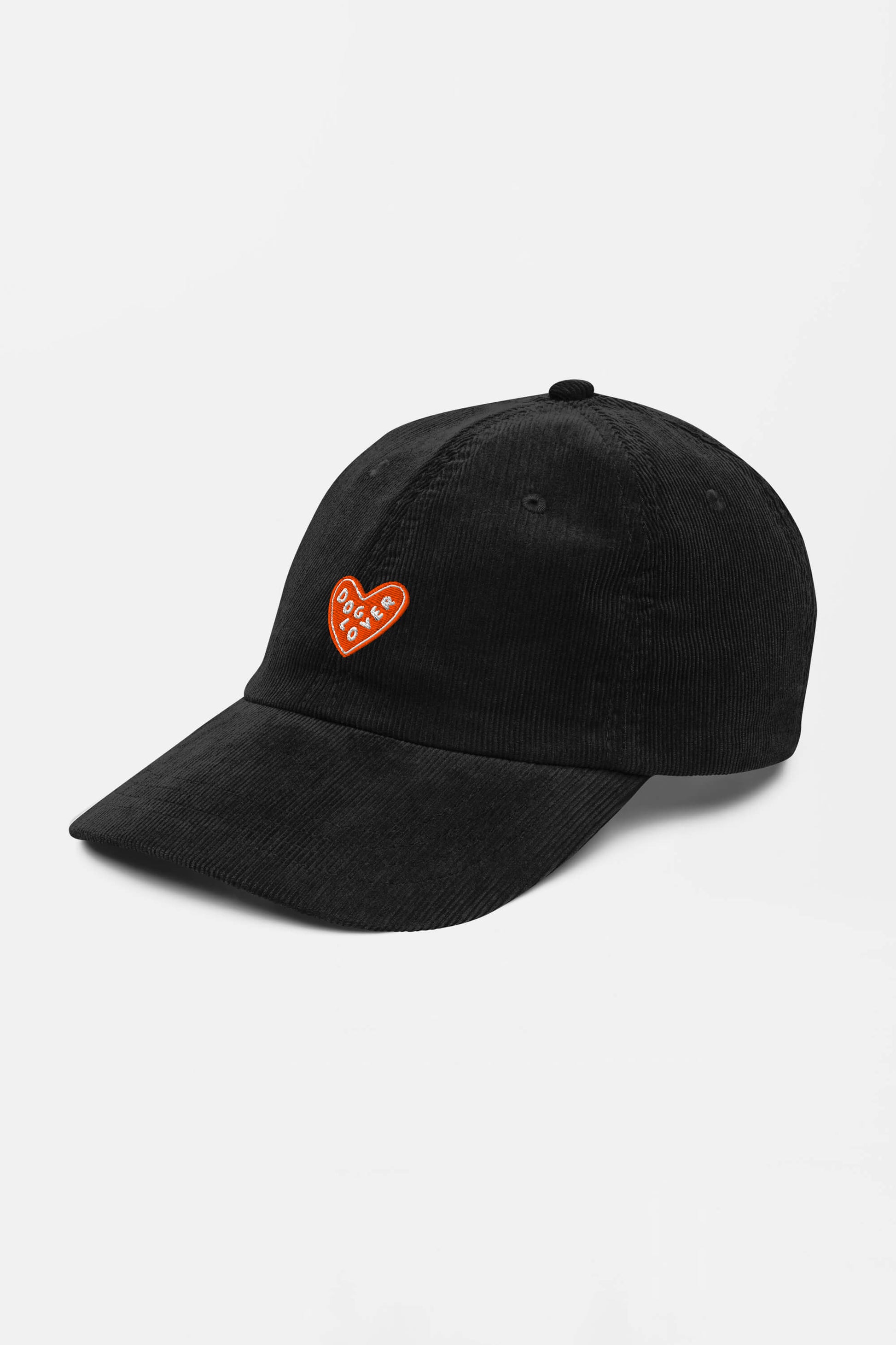 The Limited Dog Lover Corduroy Cap from Dogloverclothing.com is a vintage black adjustable baseball hat with a small red heart patch and PIVOT TO JOY in white letters, shown on a plain white background.