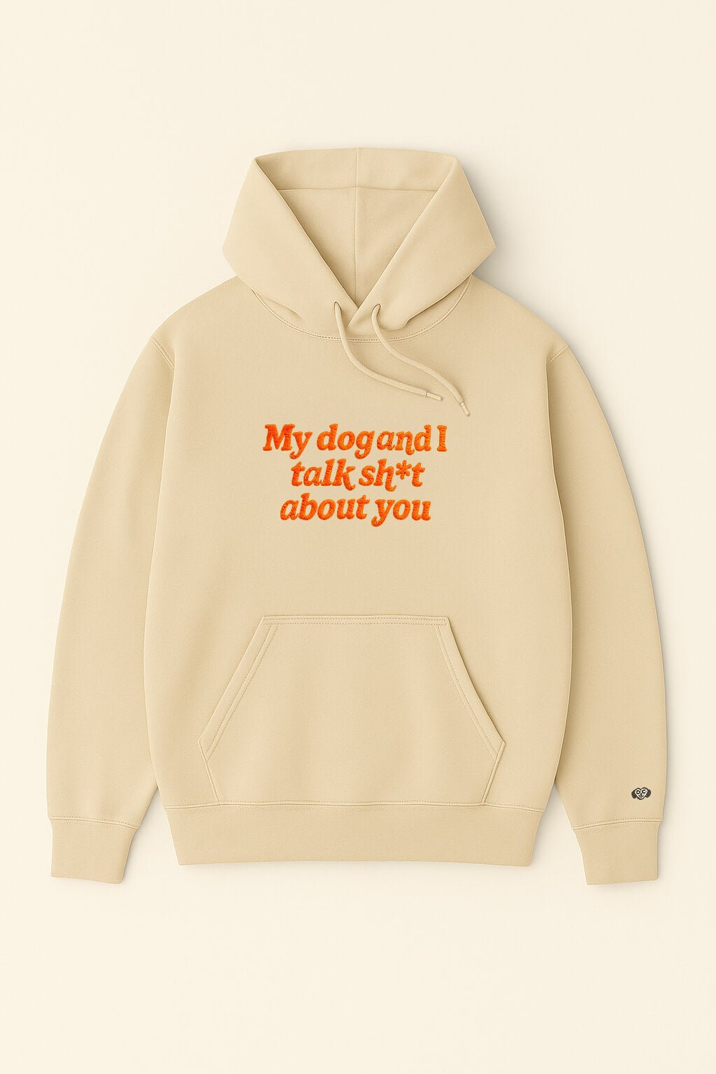 The Bold My Dog And I Talk Embroidered Hoodie from Dogloverclothing.com is a beige, classic-fit hoodie with a front pocket and My dog and I talk sh*t about you embroidered in orange on the front.