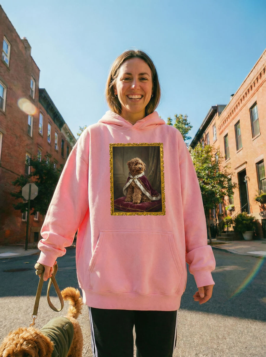 Pink custom royal dog portrait hoodie from WOOF with a framed dog painting