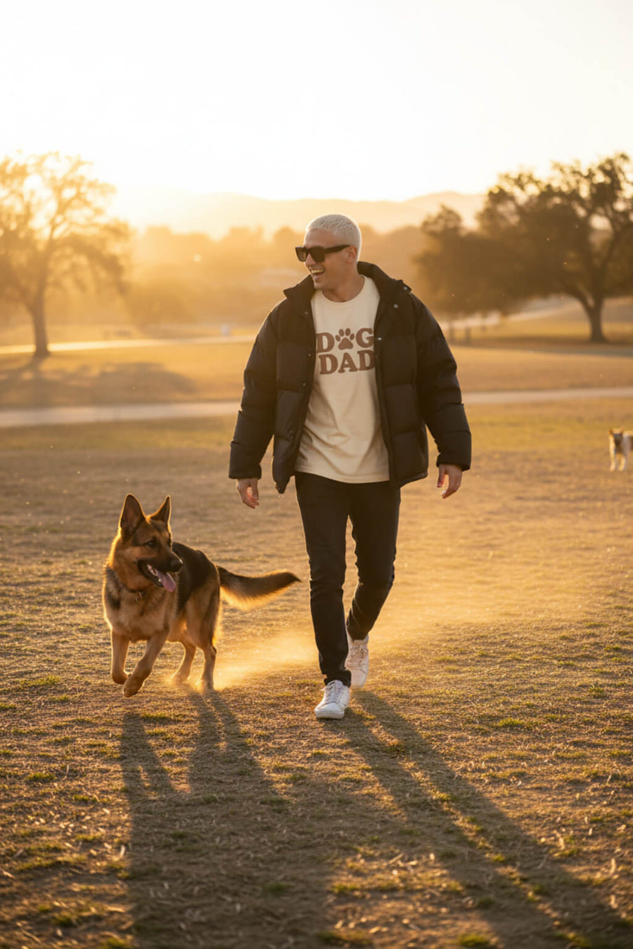 Model wearing the beige Soft Dog Dad T-Shirt from WOOF outdoors