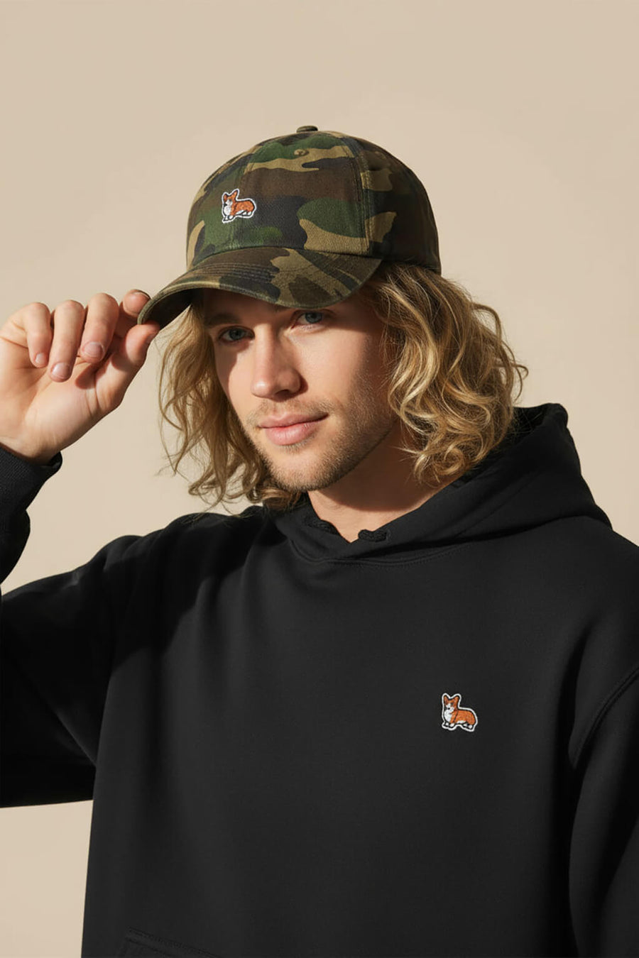 Camo Iconic Corgi Baseball Cap from WOOF, front view of the embroidery