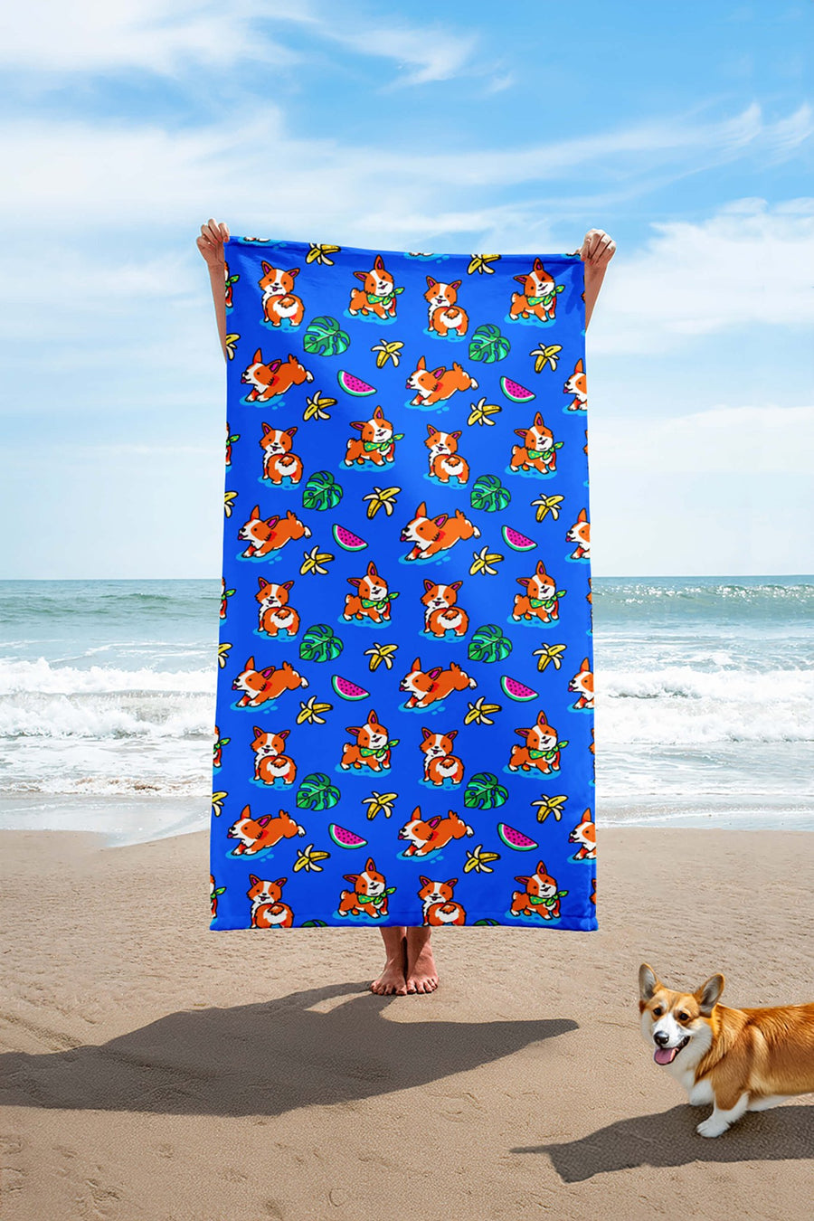 Tropical Corgi Beach Party Towel from WOOF laid out on the sand