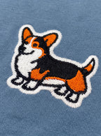 Close up of the corgi icon on the steel blue Tricolor Corgi T-Shirt from WOOF