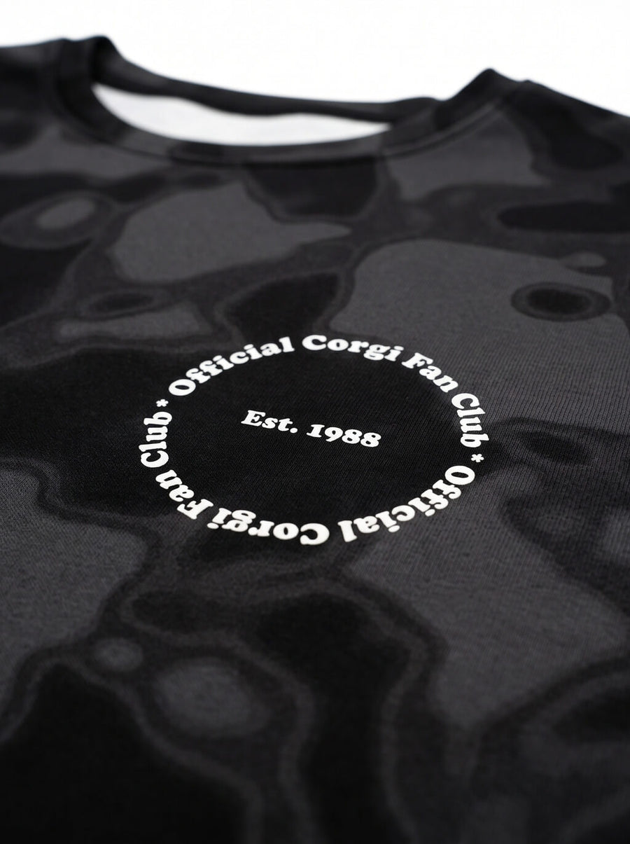 Close up of the camo pattern on the Corgi Fan Club Camo Sweatshirt from WOOF