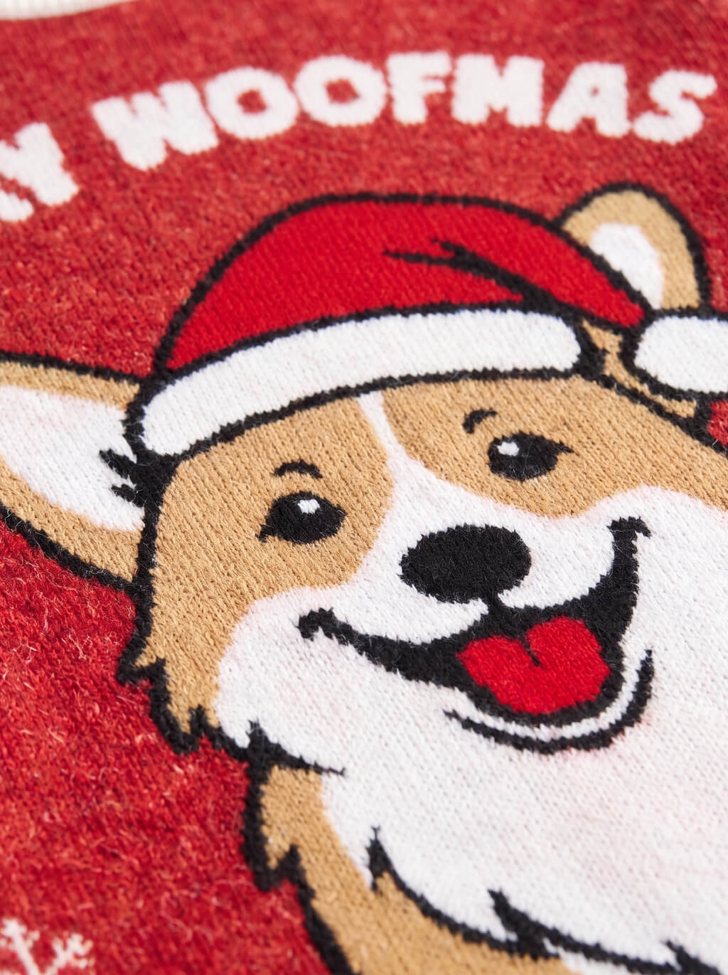 Close up of the corgi motif on the red Christmas knitted sweatshirt from WOOF