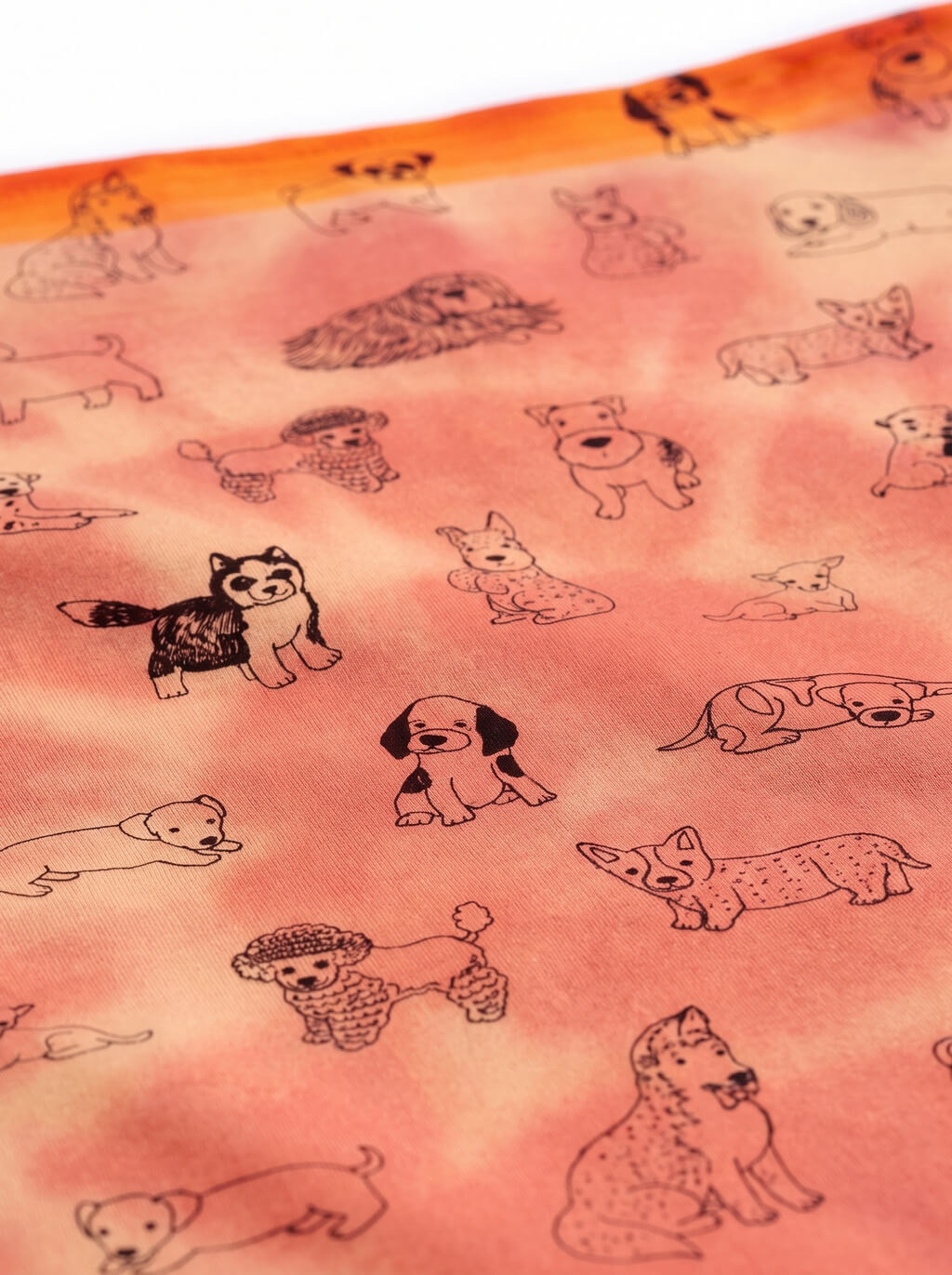 Fabric detail on the orange tie dye dog bandana from WOOF