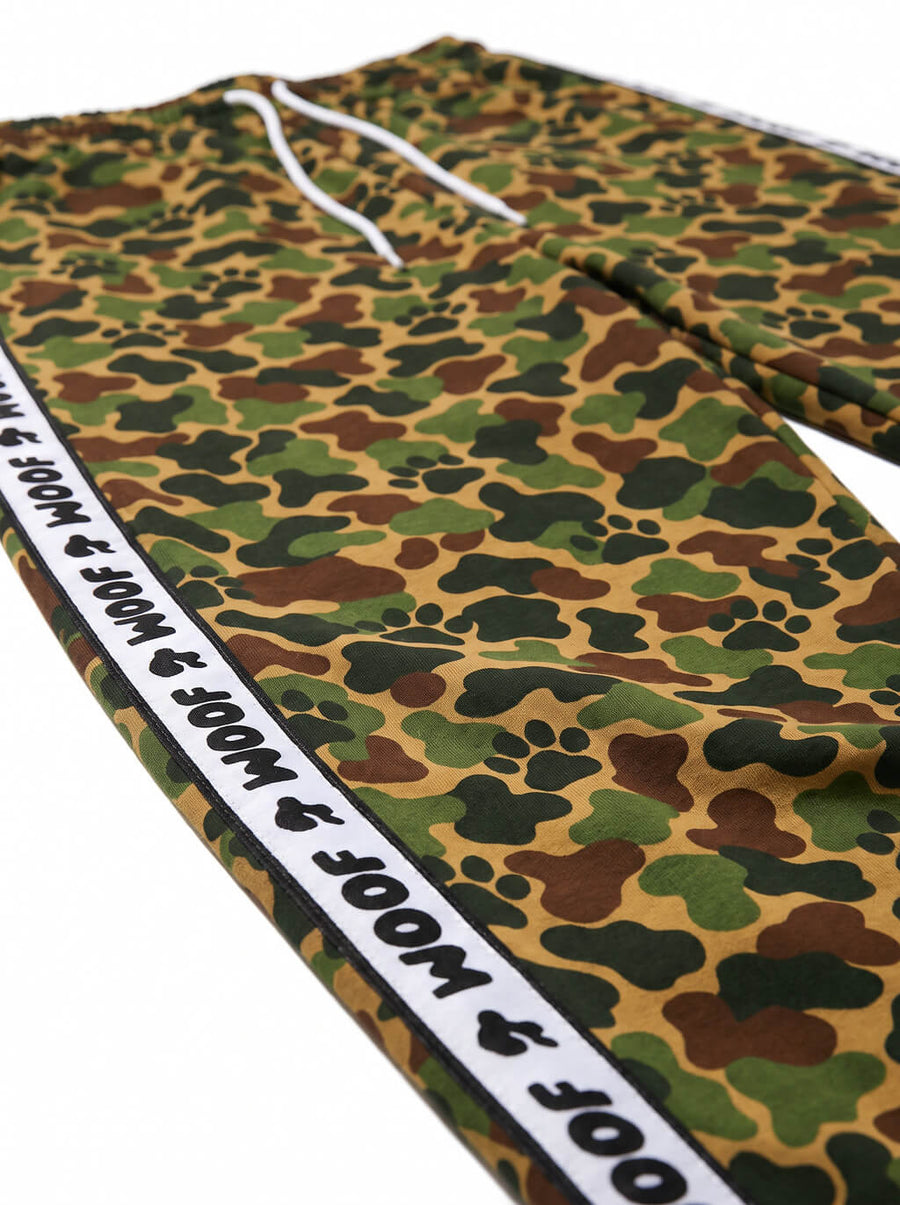 Close up of the paw print camo pattern on the joggers from WOOF