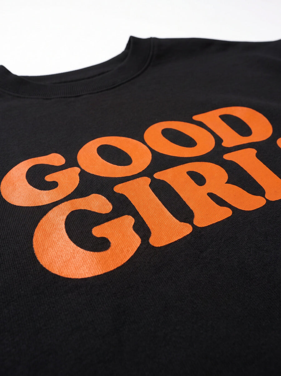 Close up of the print on the black Good Girl Dog Crop Sweatshirt from WOOF