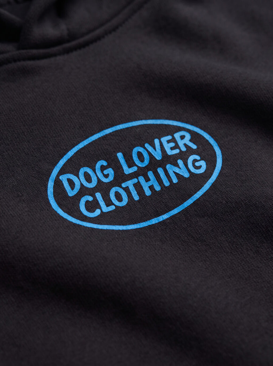 Close up of the front print on the black Life is Better with a Dog Hoodie from WOOF