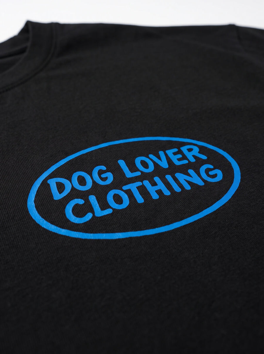 Close up of the front print on the black Life is Better with a Dog T-Shirt from WOOF