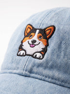Close up of the tricolor corgi patch on the blue denim cap from WOOF