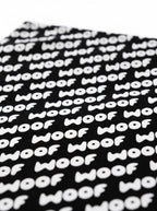 Fabric detail on the black WOOF Logo Dog Bandana