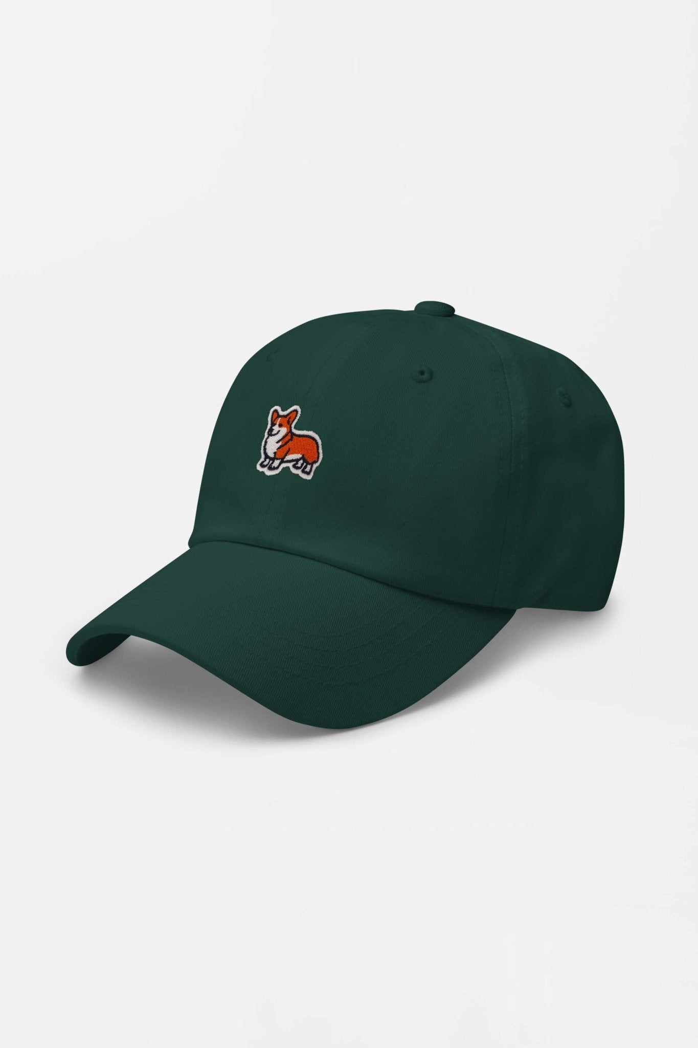 The Iconic Corgi Cap by Dogloverclothing.com features a small embroidered orange and white corgi dog on the front of a dark green cap, capturing pure Corgi cuteness against a plain white background.